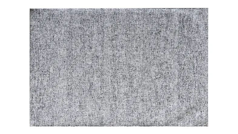 A full-length, angled shot of a rectangular silver rug. A full-length, angled shot of a rectangular silver rug.