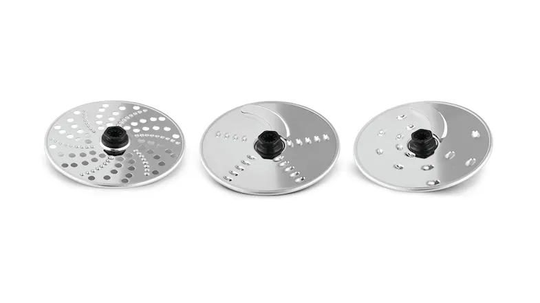 Three stainless steel food processor discs for slicing, grating, and shredding Three stainless steel food processor discs for slicing, grating, and shredding