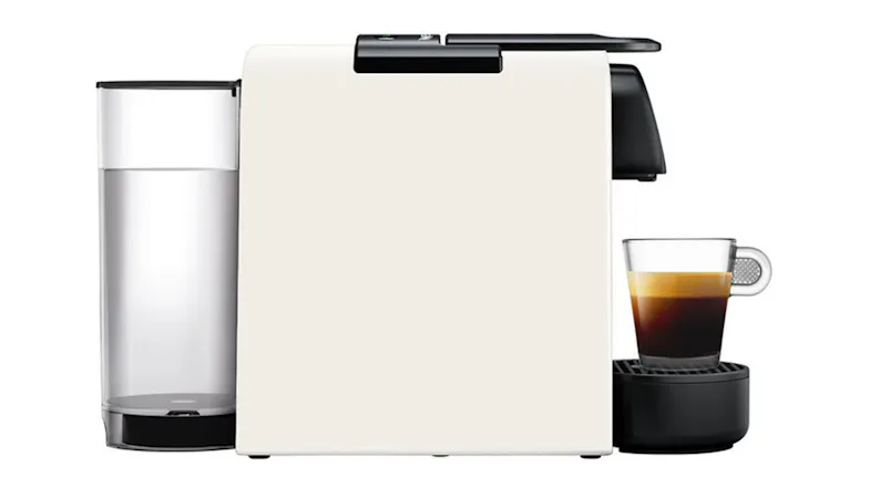 Side view of Nespresso Essenza Mini Solo espresso machine with water tank and brewed coffee Side view of Nespresso Essenza Mini Solo espresso machine with water tank and brewed coffee