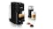 Black Nespresso coffee machine with two brewed drinks, milk frother, and two coffee capsules Black Nespresso coffee machine with two brewed drinks, milk frother, and two coffee capsules