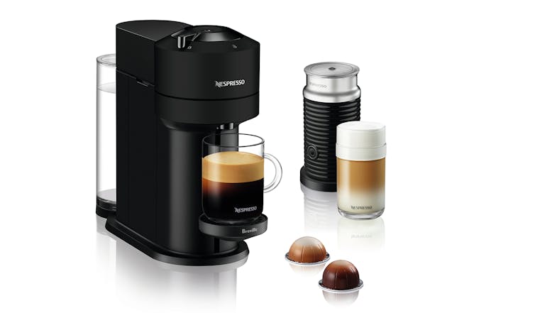 Black Nespresso coffee machine with two brewed drinks, milk frother, and two coffee capsules Black Nespresso coffee machine with two brewed drinks, milk frother, and two coffee capsules