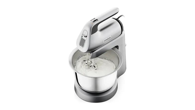 Top angled view of the Kenwood Chefette Combi mixing a white mixture inside the stainless-steel bowl Top angled view of the Kenwood Chefette Combi mixing a white mixture inside the stainless-steel bowl