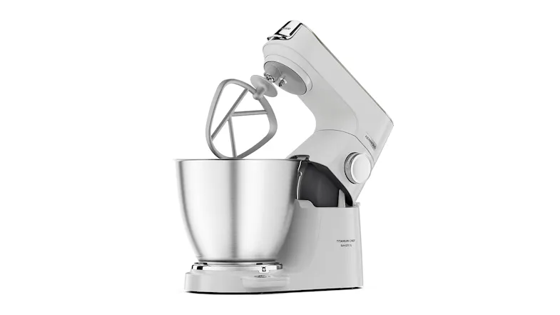 Kenwood Titanium Chef Baker XL with the head lifted and the K‑beater positioned above the stainless‑steel bowl Kenwood Titanium Chef Baker XL with the head lifted and the K‑beater positioned above the stainless‑steel bowl