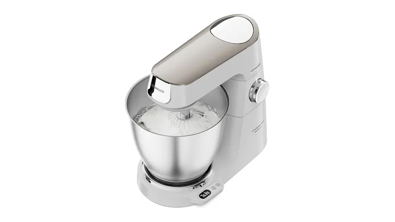Top‑angled view of the Titanium Chef Baker XL whisking a white mixture inside the stainless‑steel bowl Top‑angled view of the Titanium Chef Baker XL whisking a white mixture inside the stainless‑steel bowl
