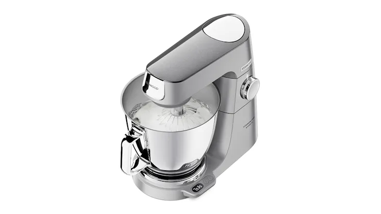 Top‑angled view of the Titanium Chef Baker XL whisking a white mixture inside the stainless‑steel bowl Top‑angled view of the Titanium Chef Baker XL whisking a white mixture inside the stainless‑steel bowl