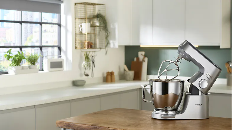 Kenwood Titanium Chef Baker XL stand mixer in silver with its head lifted and K‑beater attached Kenwood Titanium Chef Baker XL stand mixer in silver with its head lifted and K‑beater attached
