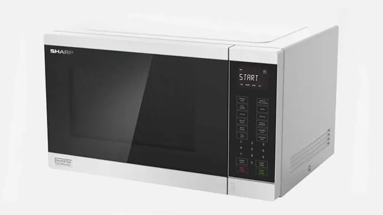 Angled view of a white Sharp microwave oven with a dark glass door and a digital control panel on the right Angled view of a white Sharp microwave oven with a dark glass door and a digital control panel on the right