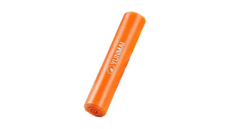 Rolled orange YUNMAI yoga resistance band showing the YUNMAI logo Rolled orange YUNMAI yoga resistance band showing the YUNMAI logo