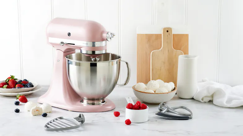KitchenAid Artisan stand mixer in Dried Rose on a kitchen countertop with a stainless steel bowl KitchenAid Artisan stand mixer in Dried Rose on a kitchen countertop with a stainless steel bowl