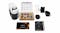 Breville Vertuo Pop Solo espresso machine with accessories, manuals, and a box of assorted coffee capsules Breville Vertuo Pop Solo espresso machine with accessories, manuals, and a box of assorted coffee capsules