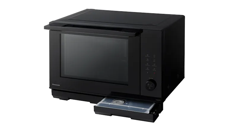 A black combination microwave with a front drawer pulled open A black combination microwave with a front drawer pulled open