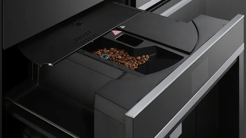 Top view of the machine with coffee beans. Top view of the machine with coffee beans.