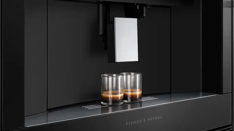 Dispensing area of the coffee machine with three glasses placed underneath. Dispensing area of the coffee machine with three glasses placed underneath.