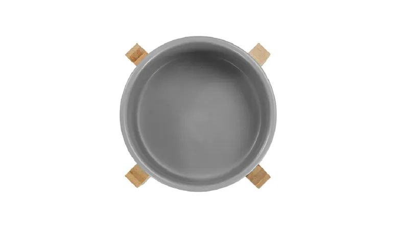 A top-down view of the ceramic pet bowl, marble/wood base A top-down view of the ceramic pet bowl, marble/wood base