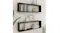 Two black NNEVL rectangular shelves mounted vertically on a wall, holding books, a round clock, picture frames, and décor Two black NNEVL rectangular shelves mounted vertically on a wall, holding books, a round clock, picture frames, and décor