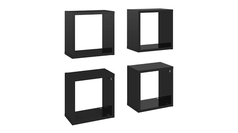 Angled view of four floating cube wall shelves in gloss black, shown in two rows Angled view of four floating cube wall shelves in gloss black, shown in two rows