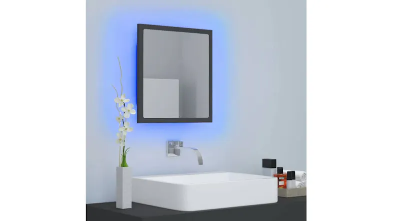 Wall-mounted mirror displaying a cool blue LED backlight effect Wall-mounted mirror displaying a cool blue LED backlight effect