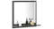 A square bathroom mirror with a built‑in shelf displaying toiletries and pump bottles A square bathroom mirror with a built‑in shelf displaying toiletries and pump bottles