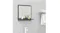 Wall-mounted bathroom mirror with a shelf holding soap bottles, installed above a sink on a grey tiled wall Wall-mounted bathroom mirror with a shelf holding soap bottles, installed above a sink on a grey tiled wall