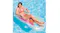 A woman relaxing on the inflatable lounge chair while floating in a pool with a bottle placed on the cup holder A woman relaxing on the inflatable lounge chair while floating in a pool with a bottle placed on the cup holder