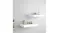 Two white floating shelves mounted on a wall and styled with decorative objects Two white floating shelves mounted on a wall and styled with decorative objects