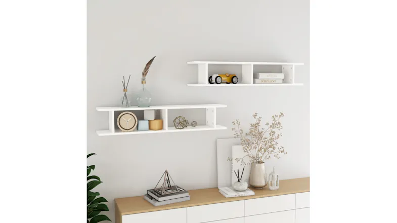 Styled living room scene with two floating ladder shelves mounted on a wall above a sideboard Styled living room scene with two floating ladder shelves mounted on a wall above a sideboard