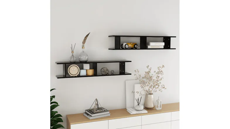Styled living room scene with two floating ladder shelves mounted on a wall above a sideboard Styled living room scene with two floating ladder shelves mounted on a wall above a sideboard