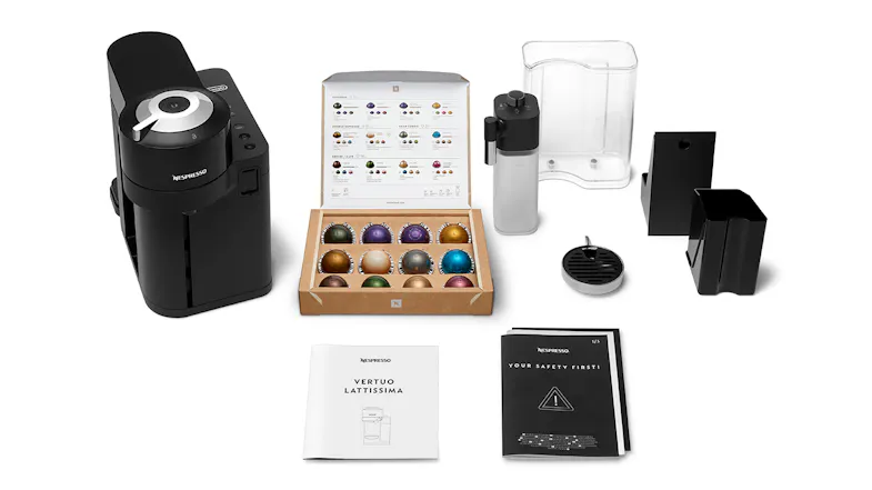 Nespresso De'Longhi Vertuo Lattissima coffee machine with accessories, user manuals, and assorted coffee capsules Nespresso De'Longhi Vertuo Lattissima coffee machine with accessories, user manuals, and assorted coffee capsules