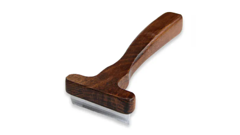 A small Maximilian Undercoat Deshedding Tool with a wooden handle, featuring a wide T‑shaped head and fine metal comb teeth A small Maximilian Undercoat Deshedding Tool with a wooden handle, featuring a wide T‑shaped head and fine metal comb teeth