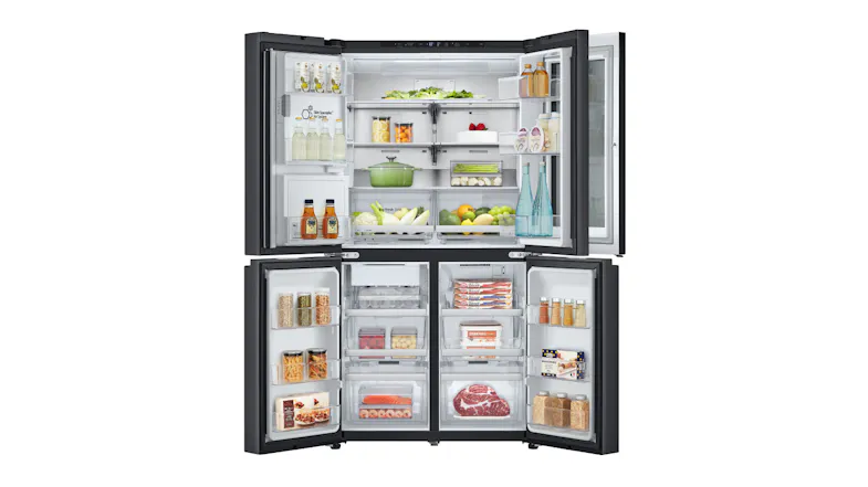 Fully stocked fridge interior with fresh produce, beverages, and frozen items organiSed across shelves Fully stocked fridge interior with fresh produce, beverages, and frozen items organiSed across shelves