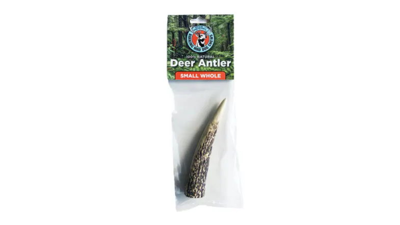 A deer antler chew on its retail packaging A deer antler chew on its retail packaging