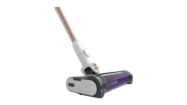 Angled view of the cordless vacuum’s motorised floor head with a transparent cover and purple roller brush Angled view of the cordless vacuum’s motorised floor head with a transparent cover and purple roller brush