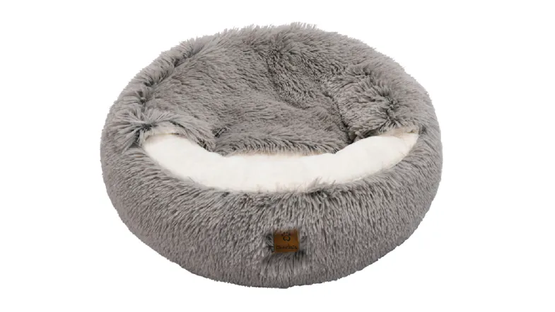 A round plush pet bed with a soft shag texture and a white cushioned centre A round plush pet bed with a soft shag texture and a white cushioned centre