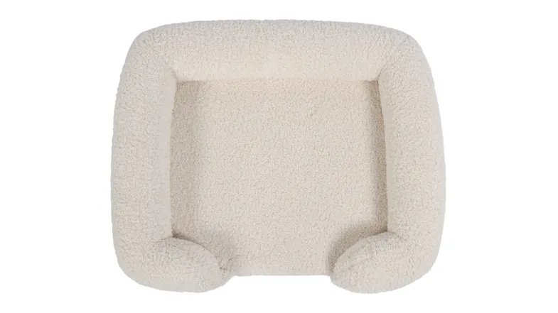 Top view of a cream fleece pet bed with raised cushioned sides Top view of a cream fleece pet bed with raised cushioned sides