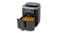 Digital air fryer with its drawer open, showing cooked fries inside Digital air fryer with its drawer open, showing cooked fries inside