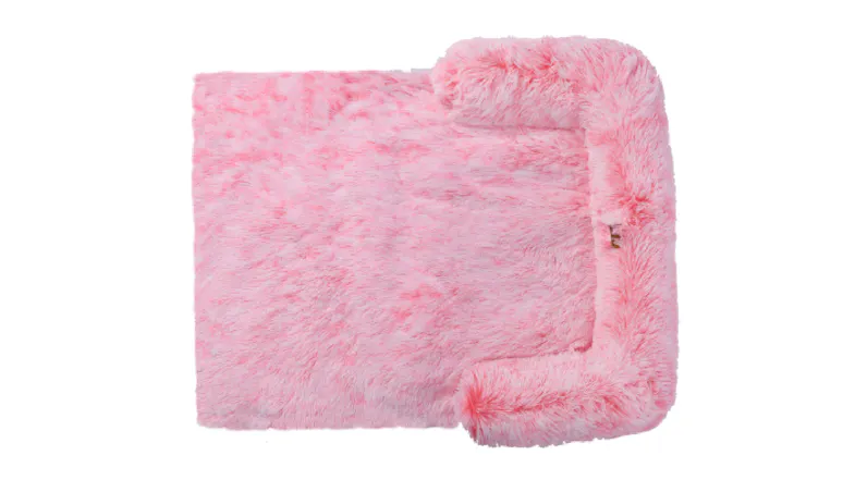 A side view of a pink shaggy faux fur square pet bed A side view of a pink shaggy faux fur square pet bed
