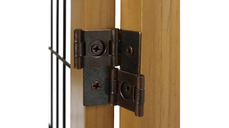 Close-up of the metal hinge connecting two pinewood panels on the pet gate, featuring visible screws and solid, durable hardware detail Close-up of the metal hinge connecting two pinewood panels on the pet gate, featuring visible screws and solid, durable hardware detail