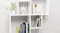 Stylish wall shelf with books, plants, and decor Stylish wall shelf with books, plants, and decor