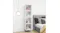 Four cube shelves stacked vertically beside a bed with pillows Four cube shelves stacked vertically beside a bed with pillows