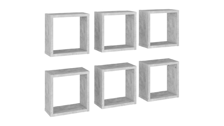 Angled view of six floating cube wall shelves in concrete grey, shown in two rows Angled view of six floating cube wall shelves in concrete grey, shown in two rows
