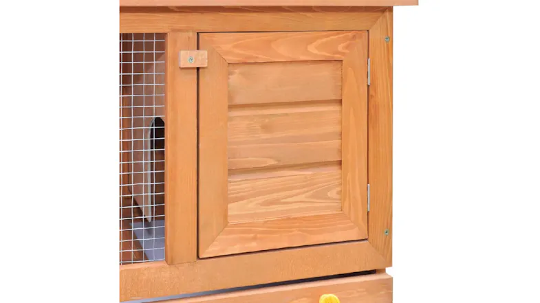 Close-up of a wooden hutch door beside a wire mesh panel Close-up of a wooden hutch door beside a wire mesh panel