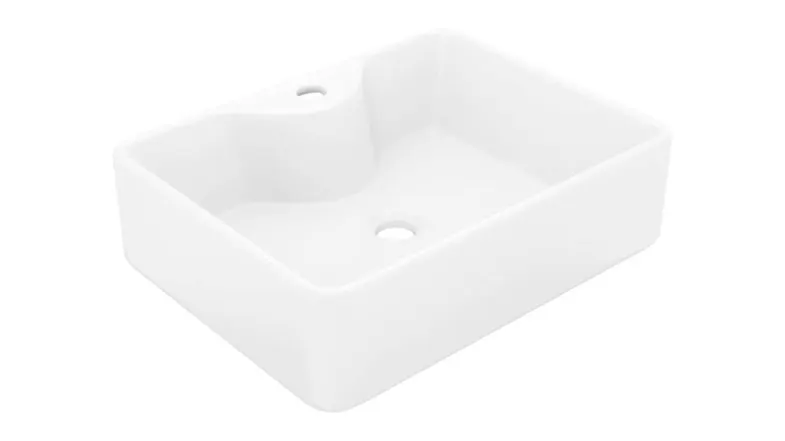 Angled top-down view of a rectangular white NNEVL ceramic bathroom sink with a single faucet hole and a centred drain Angled top-down view of a rectangular white NNEVL ceramic bathroom sink with a single faucet hole and a centred drain