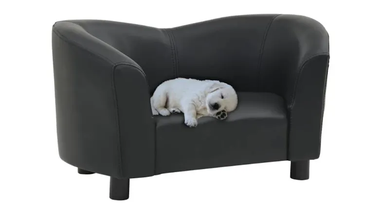A small puppy is sleeping on a black faux leather dog sofa, showcasing the cushioned seating area and supportive armrest design A small puppy is sleeping on a black faux leather dog sofa, showcasing the cushioned seating area and supportive armrest design
