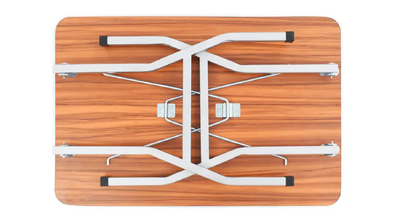 Folded metal table legs attached to the underside of a rectangular wood‑grain tabletop Folded metal table legs attached to the underside of a rectangular wood‑grain tabletop