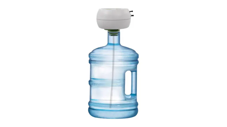 Automatic irrigation timer mounted on a large water bottle, showing a gravity‑fed watering setup with an intake tube inside Automatic irrigation timer mounted on a large water bottle, showing a gravity‑fed watering setup with an intake tube inside