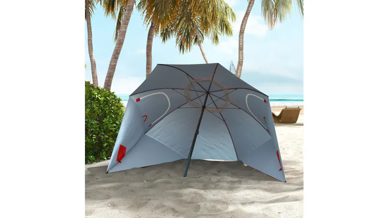 A 2.4m beach umbrella with integrated side walls and vents, placed on sand near palm trees A 2.4m beach umbrella with integrated side walls and vents, placed on sand near palm trees