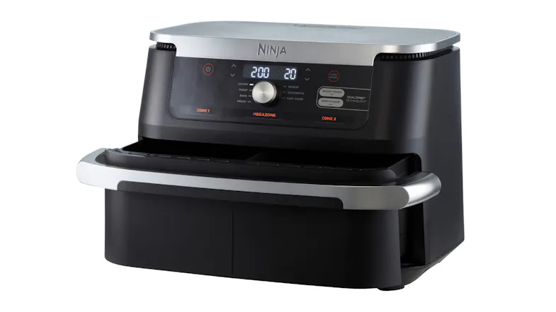 Angled view of the Ninja MegaZone air fryer with control panel and a drawer partially open Angled view of the Ninja MegaZone air fryer with control panel and a drawer partially open