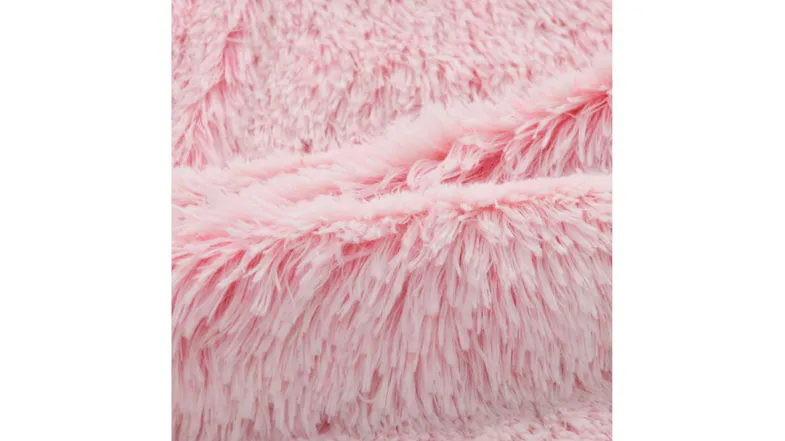 A close-up view of a sofa protector’s faux fur material A close-up view of a sofa protector’s faux fur material