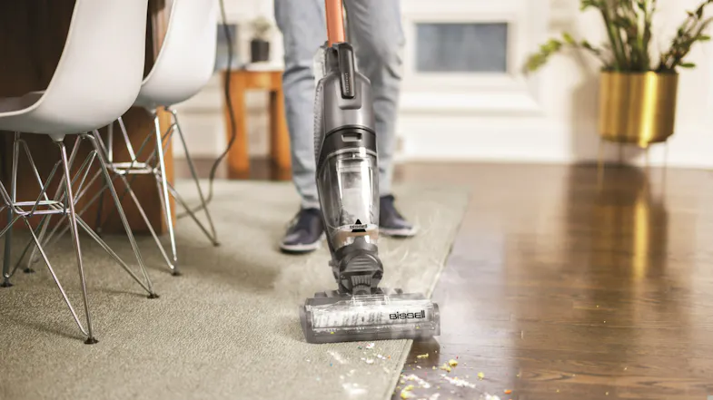 The Bissell CrossWave HydroSteam Professional transitions from a rug to a hardwood floor The Bissell CrossWave HydroSteam Professional transitions from a rug to a hardwood floor