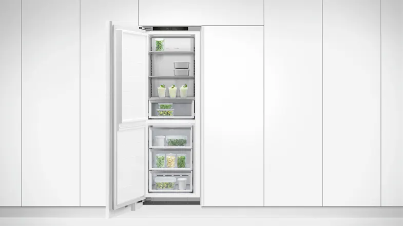 A view of the freezer installed flush on a white sleek wall A view of the freezer installed flush on a white sleek wall